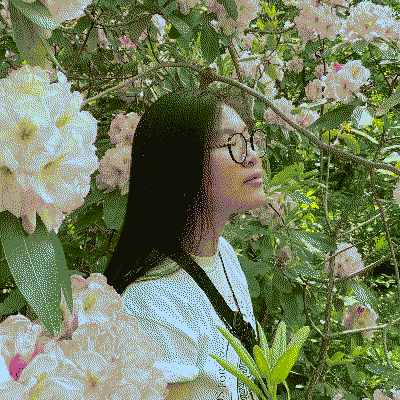 a dithered image of me surrounded by flowers